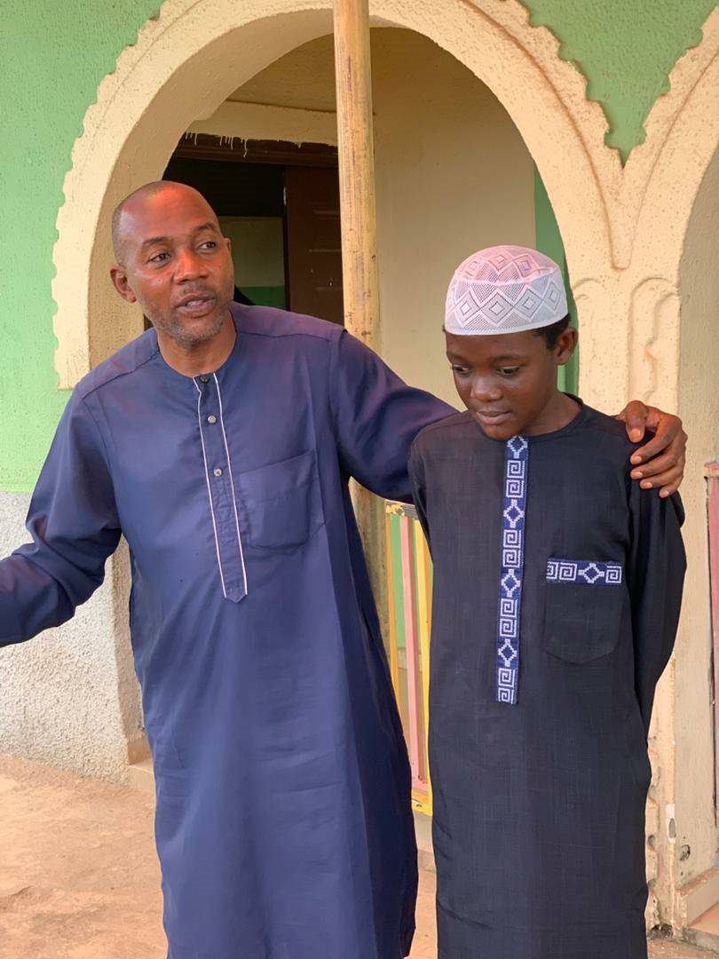 Founder of Al-Muflihoon International School speaking with a student