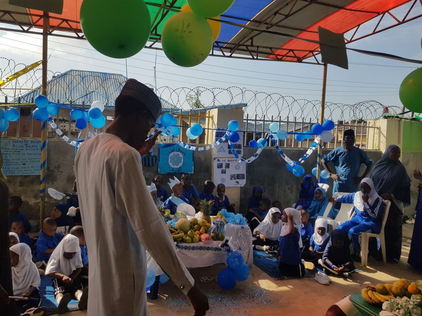 Students and staff during a blue-themed school learning display